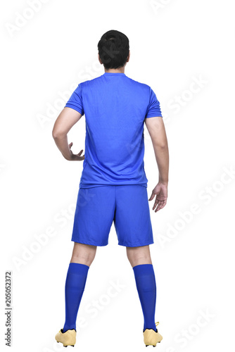 Rear view of asian soccer player in blue jersey