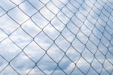 Wire mesh fence (Rabitz net) against cloudy sky