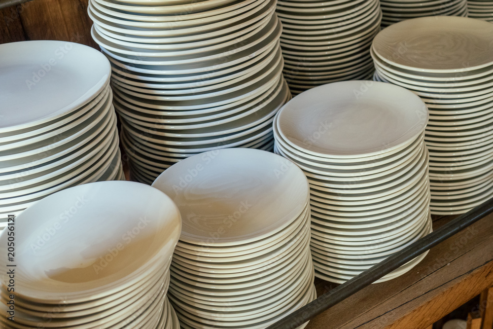 shelf with white ceramic plates