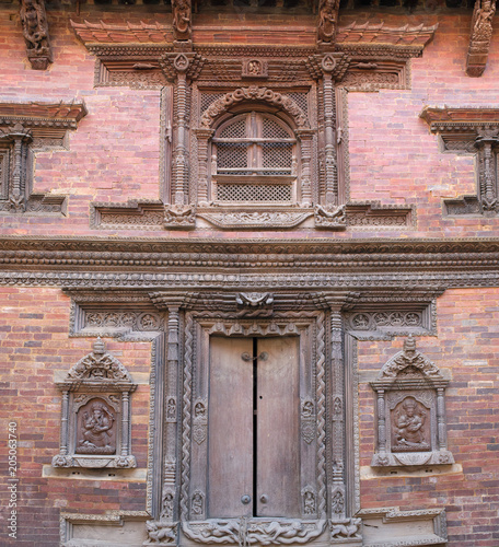 Nepalese wooden carving at the facade of palace in Patan, Kathmandu valley, Nepal