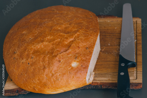 White bread and knife on the table photo