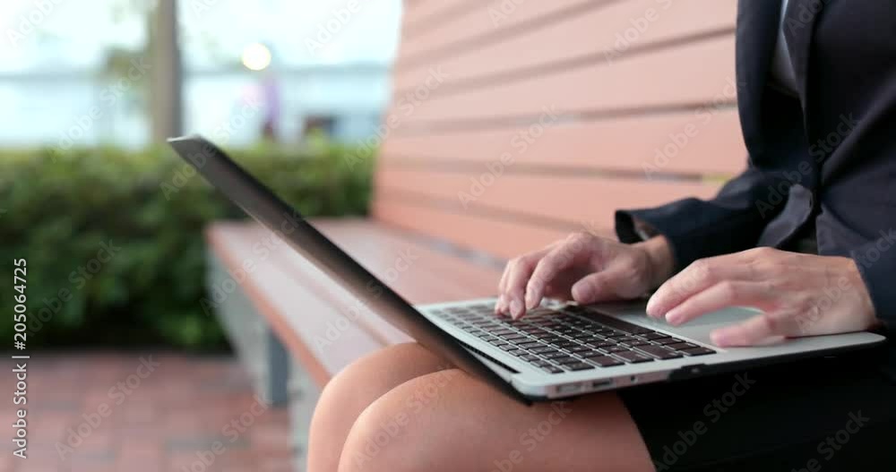 Business woman work on notebook computer Business woman work on notebook computer