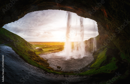 Perfect view of famous powerful Seljalandsfoss waterfall in sunlight. Location place Iceland, sightseeing Europe.