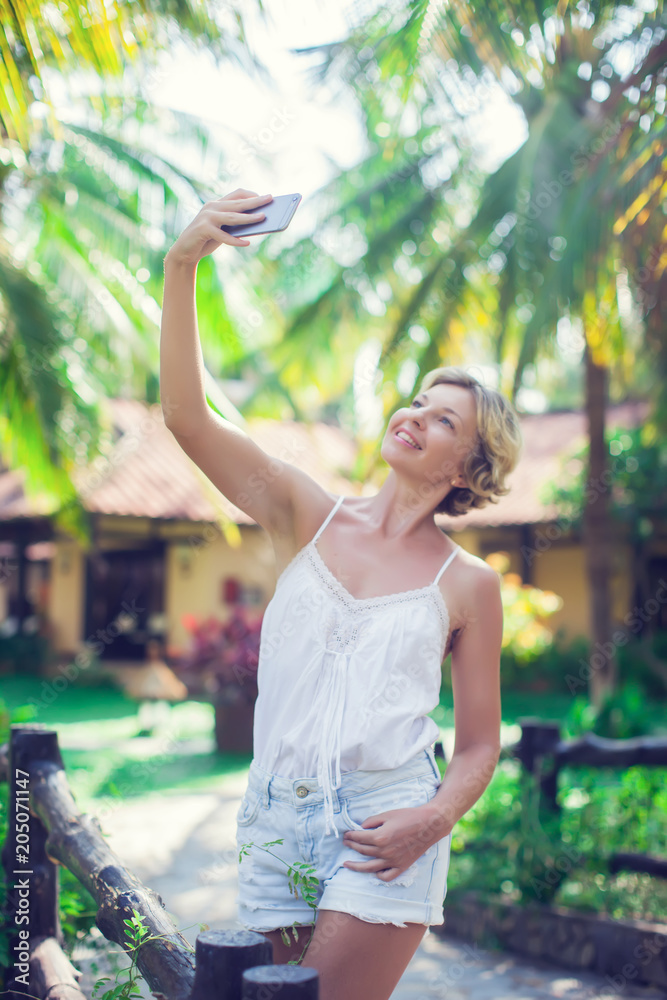 Smiling young woman take a selfie photo outdoor Smiling young woman take a selfie photo outdoor