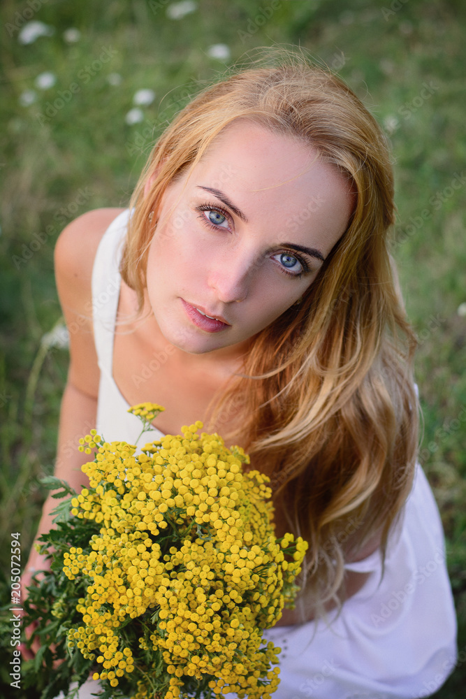 Beautiful woman with field flowers Beautiful woman with field flowers