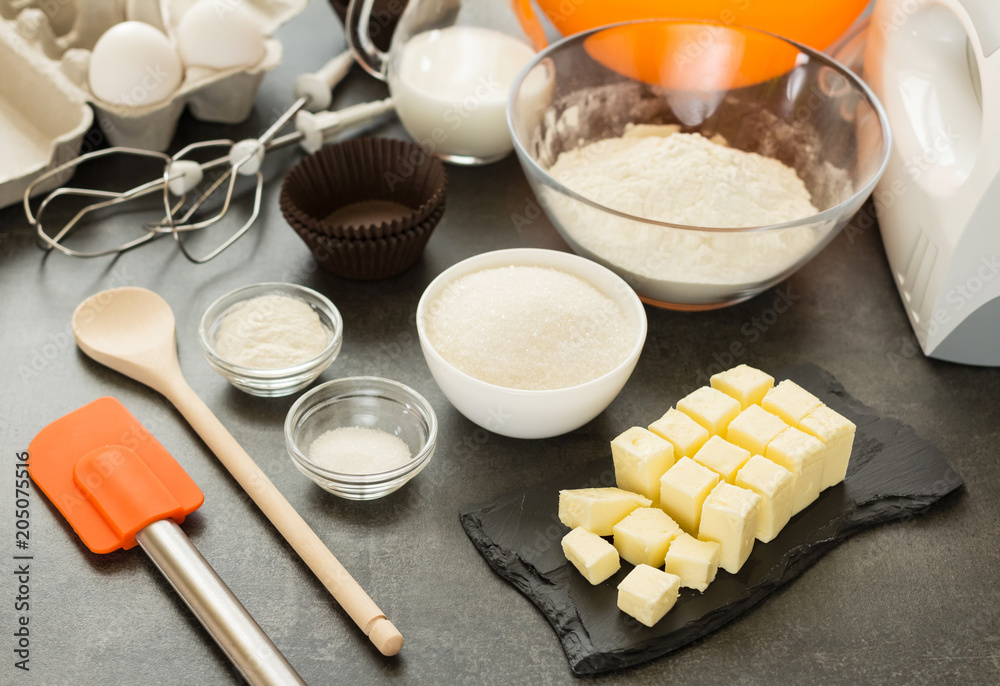 Set of products for preparation of biscuits and mixer on work surface Set of products for preparation of biscuits and mixer on work surface