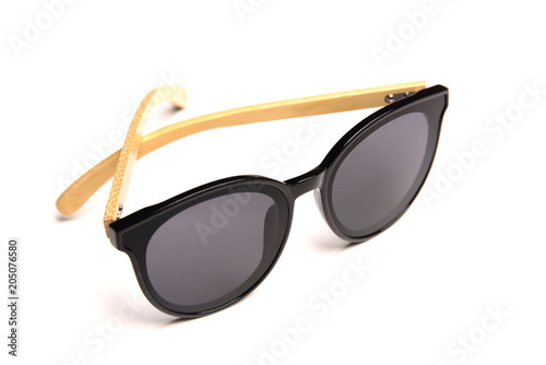 Stylish sunglasses with wooden rim isolated on white background