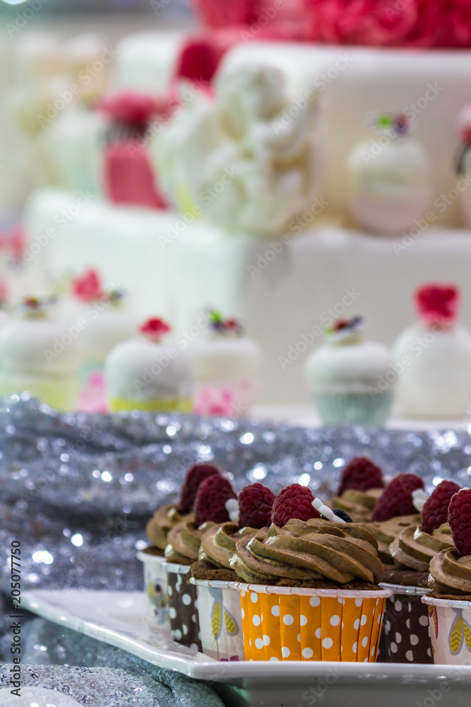 Homemade topping sweet wedding cupcake./ Homemade sweet beauty flower and topping decoration on wedding cupcake.