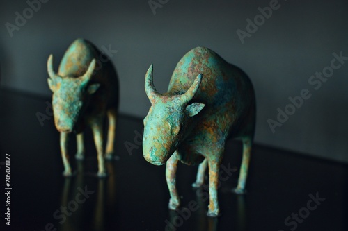ancient Asian decoration interior oxen figurines on a dark grey background
