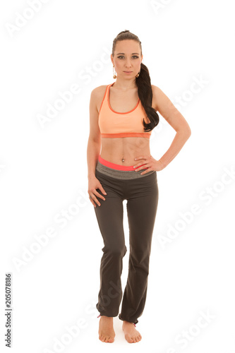 Young woman practice yoga standing isolated over white background