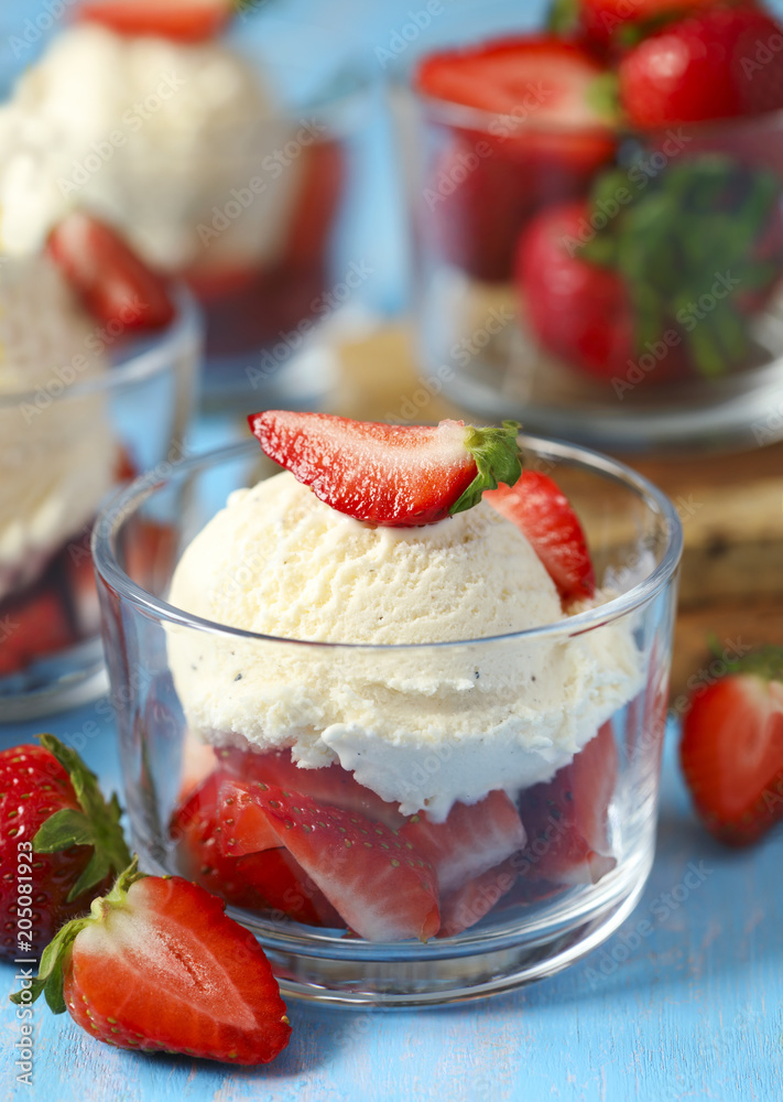 French vanilla ice cream with fresh strawberries French vanilla ice cream with fresh strawberries
