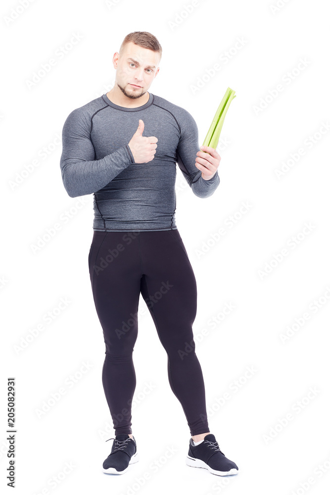 Portrait of handsome sporty man holding fresh celery isolated on white Portrait of handsome sporty man holding fresh celery isolated on white