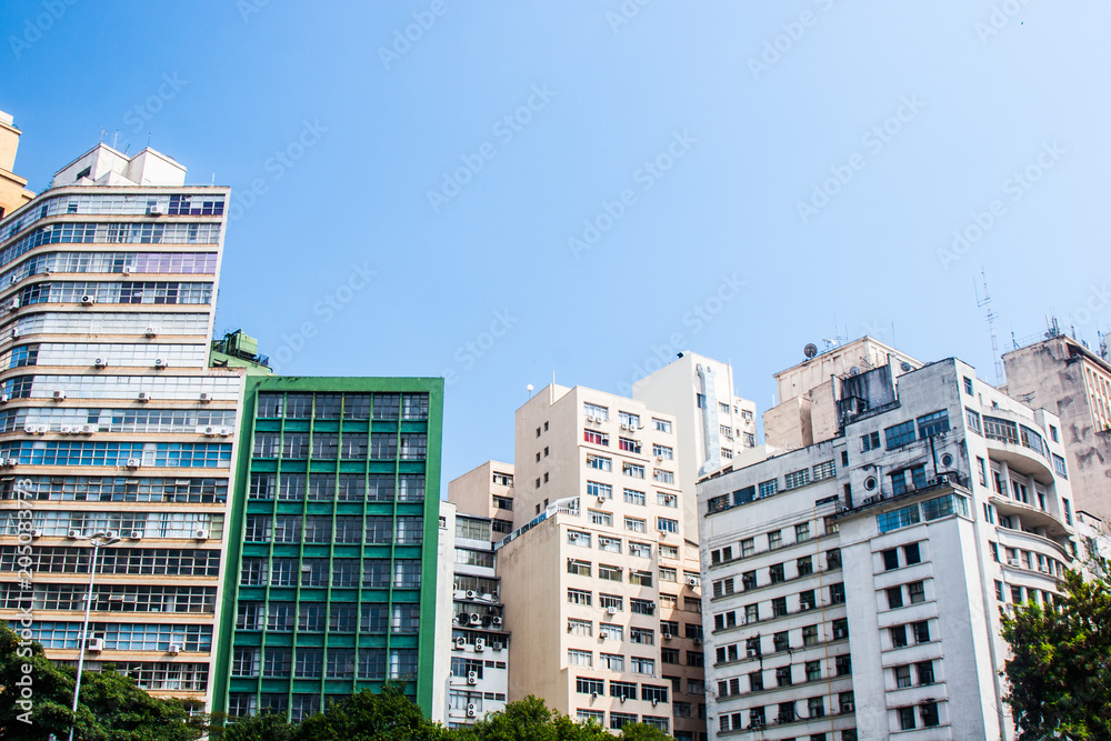 Business and residential buildings with blue sky background