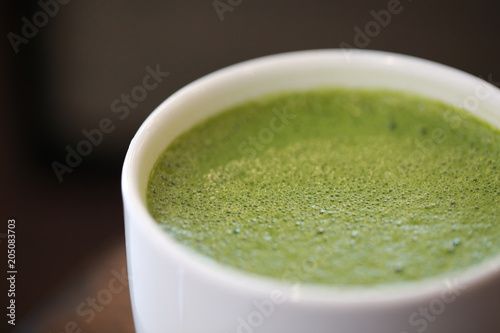 Closeup macro hot green tea latte
