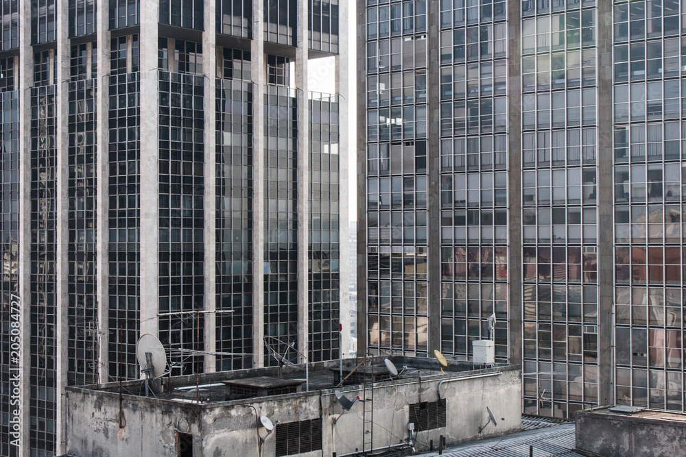 Tall office towers seen from the top of a commercial building.