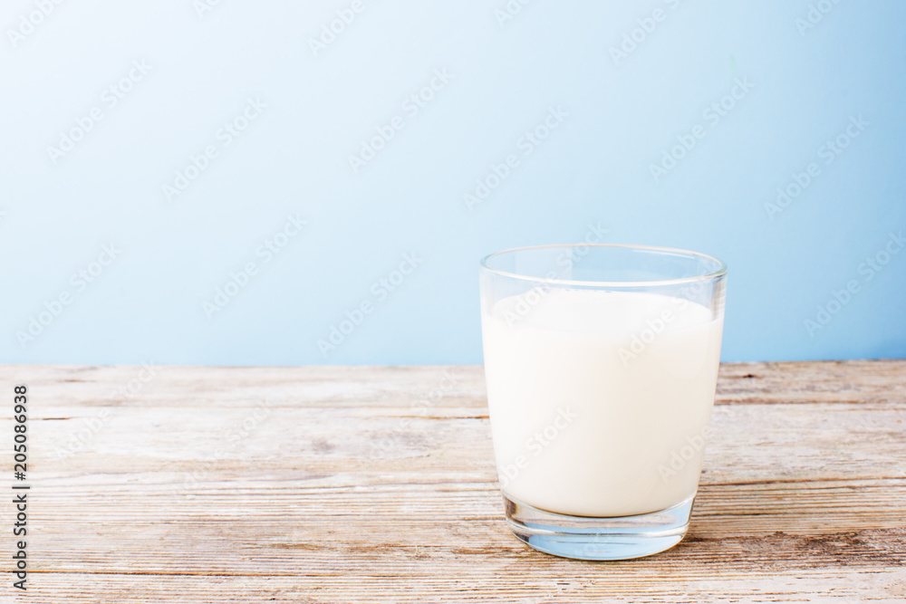 glass of milk on a light table glass of milk on a light table