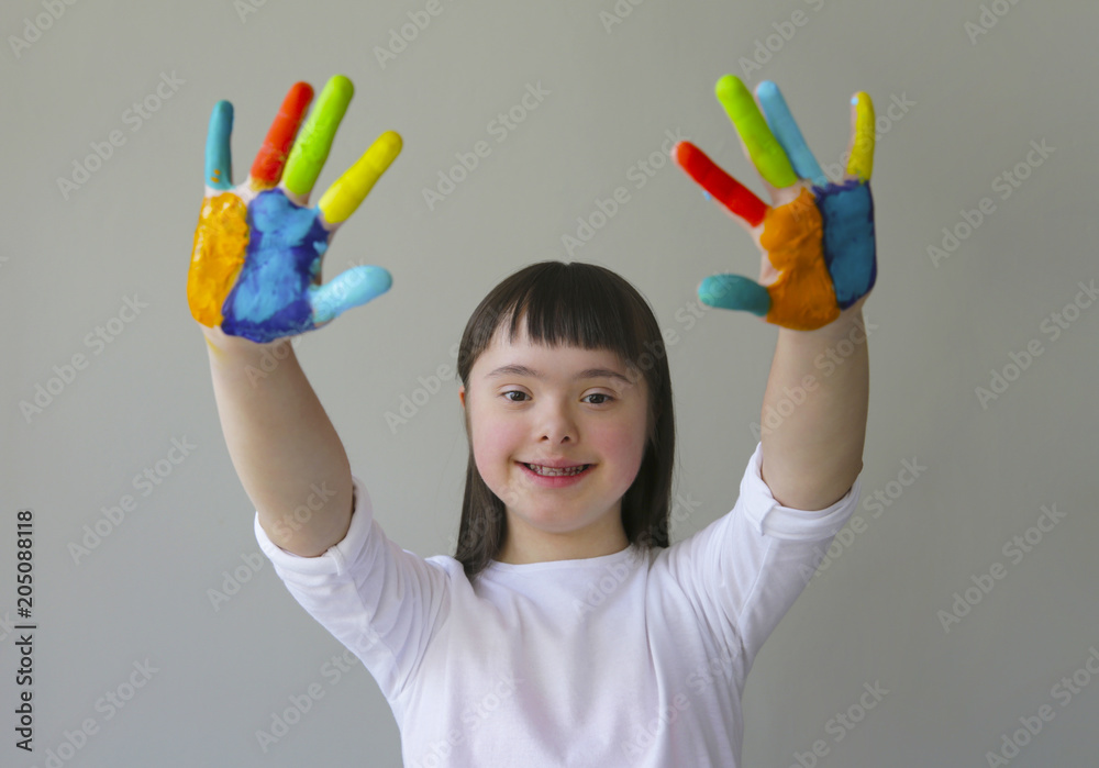 Fototapeta premium Cute little girl with painted hands.