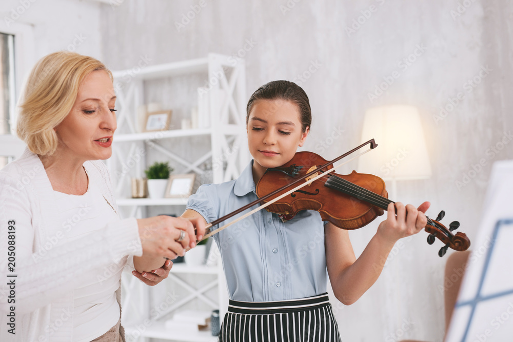 Keep it correct. Enigmatical girl holding violin while going to play melody Keep it correct. Enigmatical girl holding violin while going to play melody