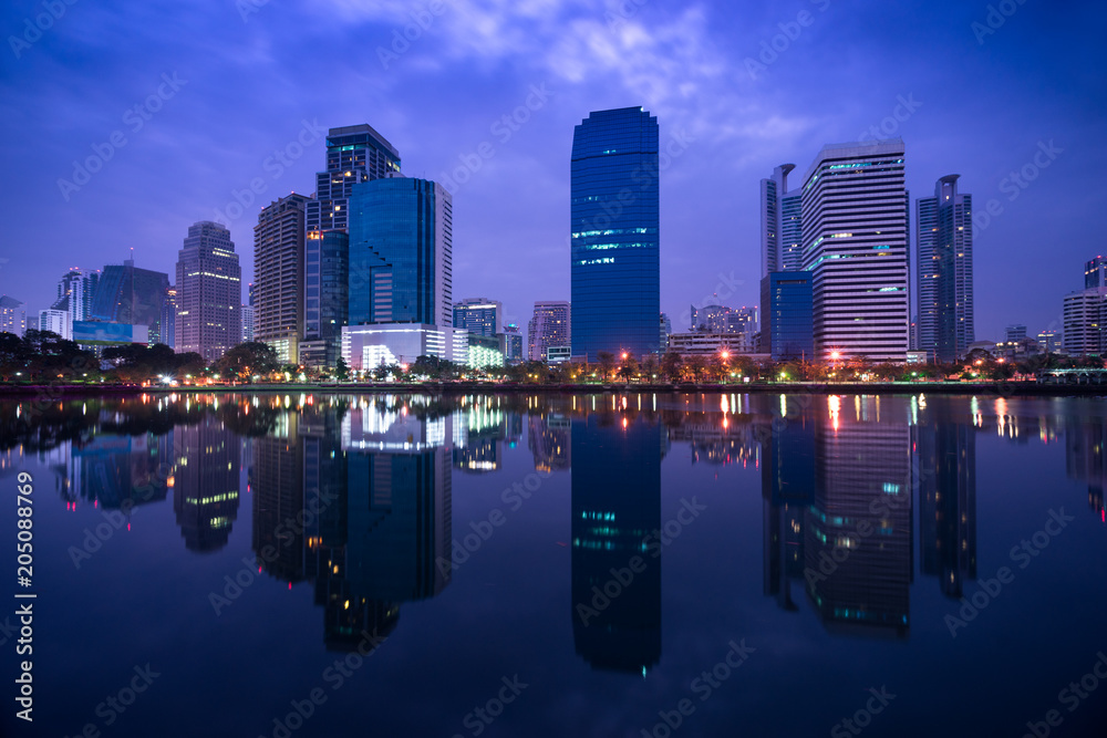 Naklejka premium urban cityscape building mirror on water in twilight time
