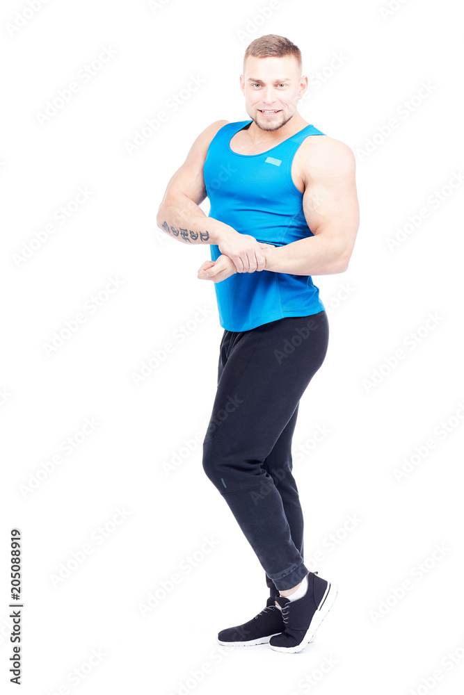 Portrait of strong athletic man in sports clothes posing on white background Portrait of strong athletic man in sports clothes posing on white background