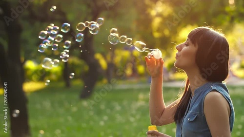 Woman blowing bubbles