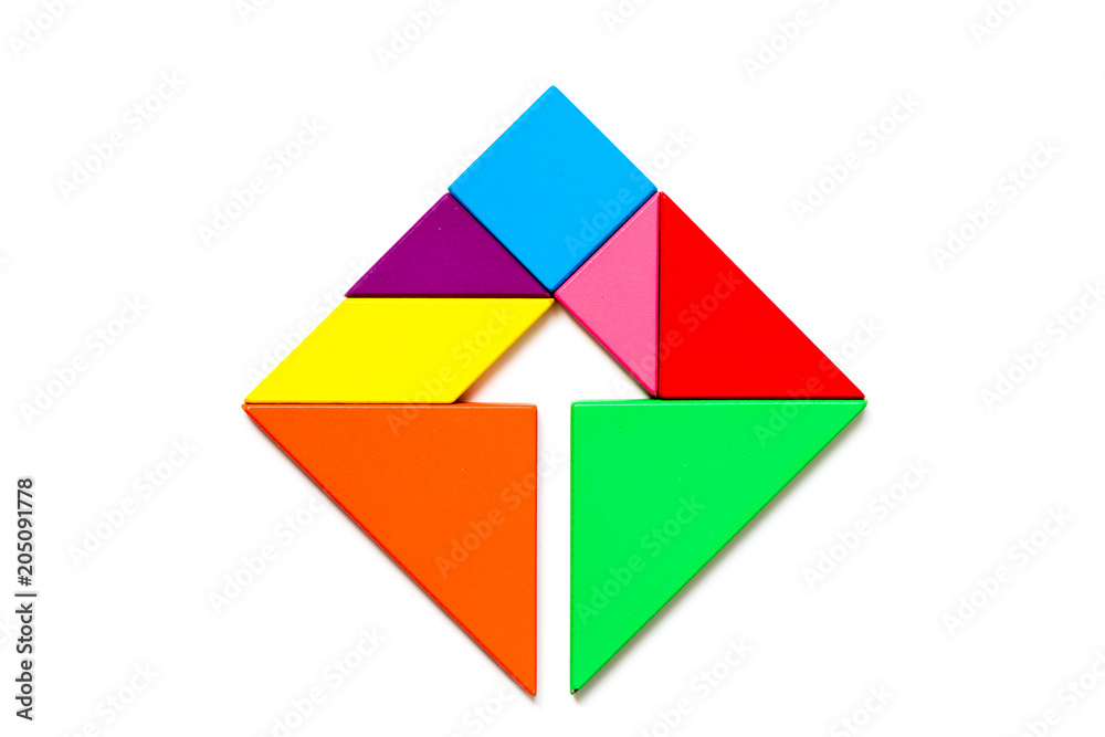 Color wood tangram puzzle in square with inside arrow shape on white background Color wood tangram puzzle in square with inside arrow shape on white background