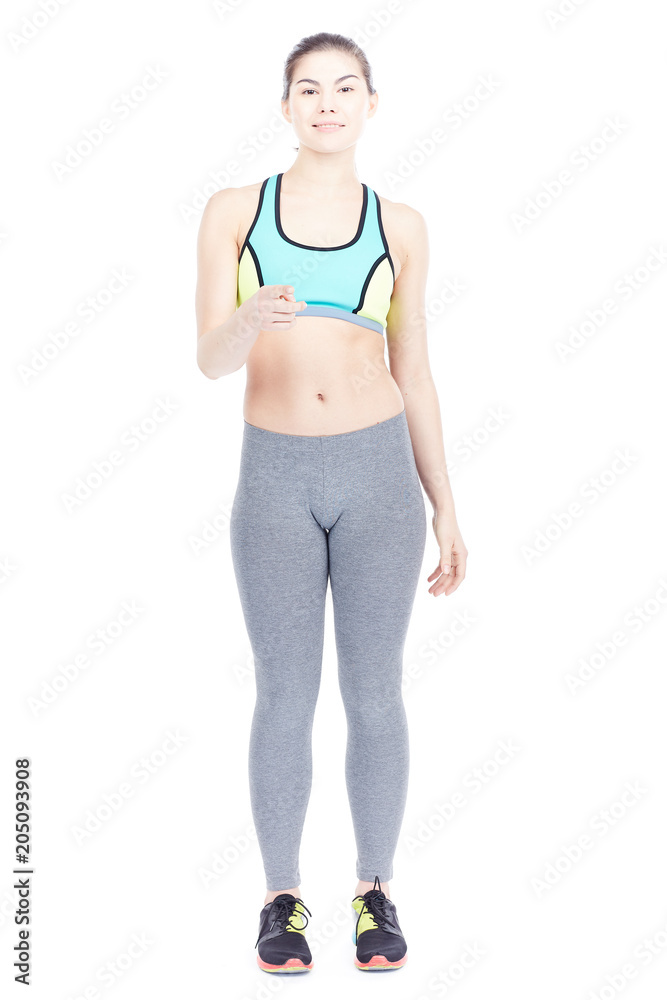 Isolated portrait of beautiful fit woman posing in sports tights and bra Isolated portrait of beautiful fit woman posing in sports tights and bra