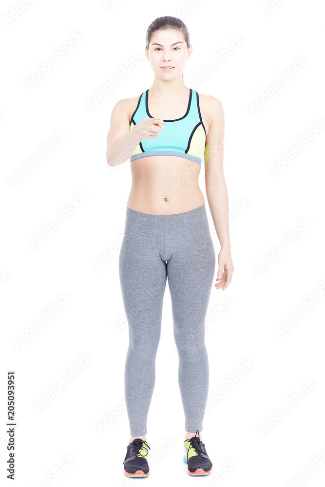 Isolated portrait of beautiful fit woman posing in sports tights and bra Isolated portrait of beautiful fit woman posing in sports tights and bra