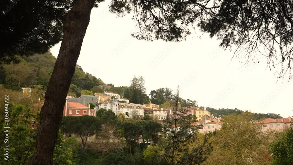 Famous village of Sintra, Portugal. Gimbal walking shot show a cluster of houses sittting on a hill. Famous village of Sintra, Portugal. Gimbal walking shot show a cluster of houses sittting on a hill.