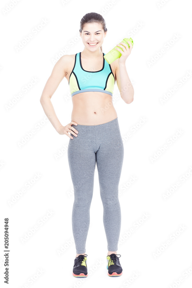 Portrait of slim girl in sports clothes holding water bottle on white background Portrait of slim girl in sports clothes holding water bottle on white background