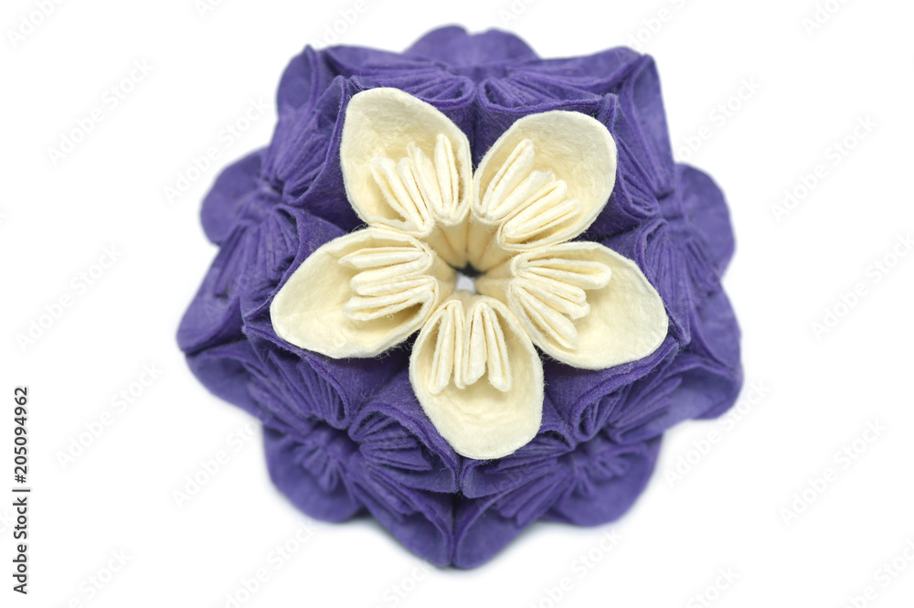 Purple and white origami kusudama flower on white background Purple and white origami kusudama flower on white background