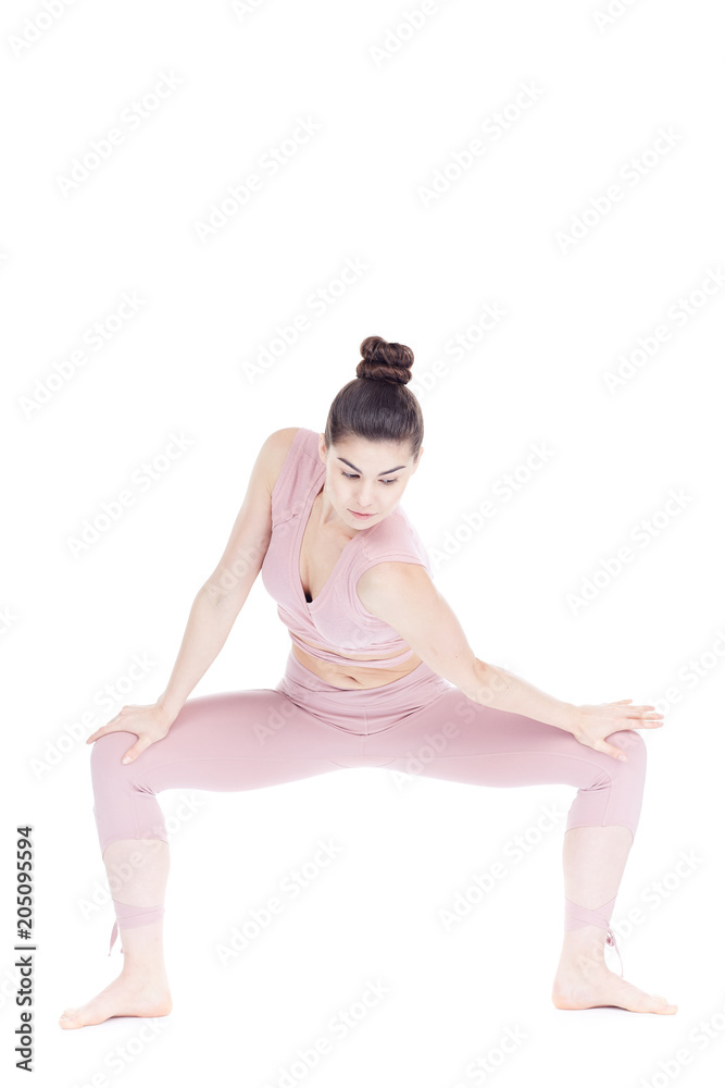 Fototapeta premium Young woman, professional yoga instructor practicing asanas isolated on white