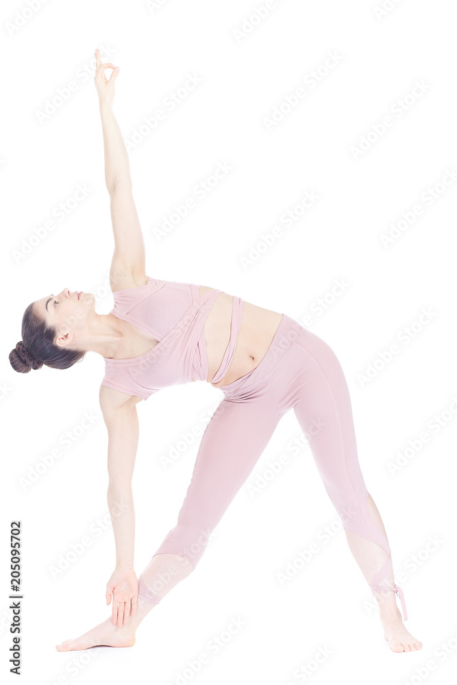 Young woman, professional yoga instructor practicing asanas isolated on white