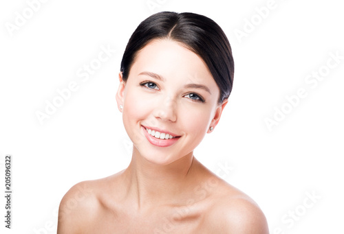 Beauty portrait of smiling woman. Perfect skin and Nude makeup. Isolated on white background