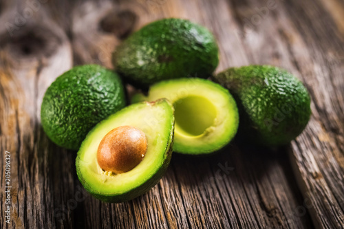 Foto Avocados on wooden background