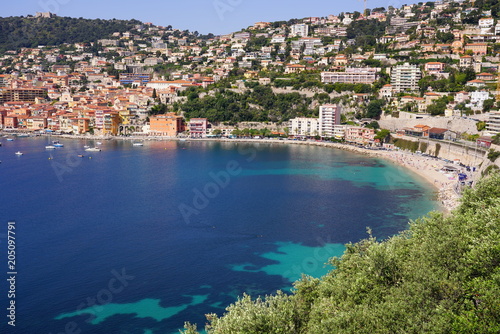 Panoramic view of the harbor town of Villefranche sur Mer, a coastal resort city on the Mediterranean Sea on the French Riviera seen from the Corniche