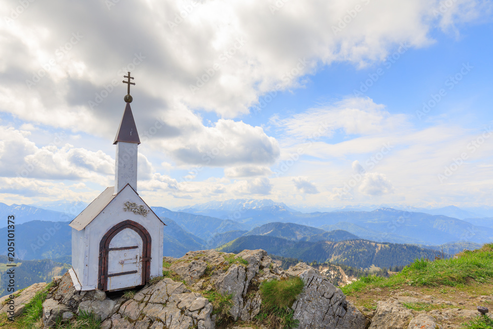 small chapel at Mountain Hochgern with view to alps on sunny summer day