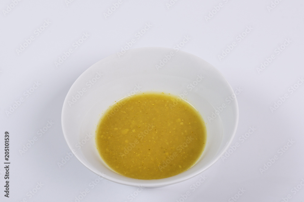 Creamy broccoli soup on a white Creamy broccoli soup on a white