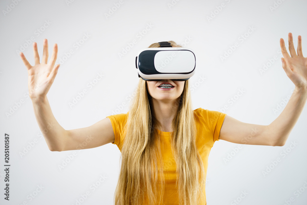 Girl wearing virtual reality goggles. Girl wearing virtual reality goggles.