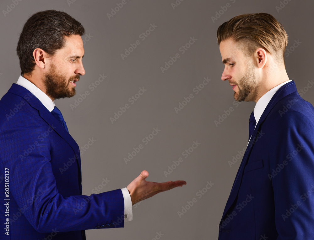 Unshaven businessman with smile raising hand for shaking hands g Unshaven businessman with smile raising hand for shaking hands g