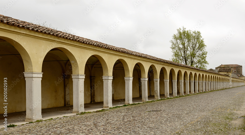 arches of santa Maria covered walkway on Mazzini street, Comacchio, Italy