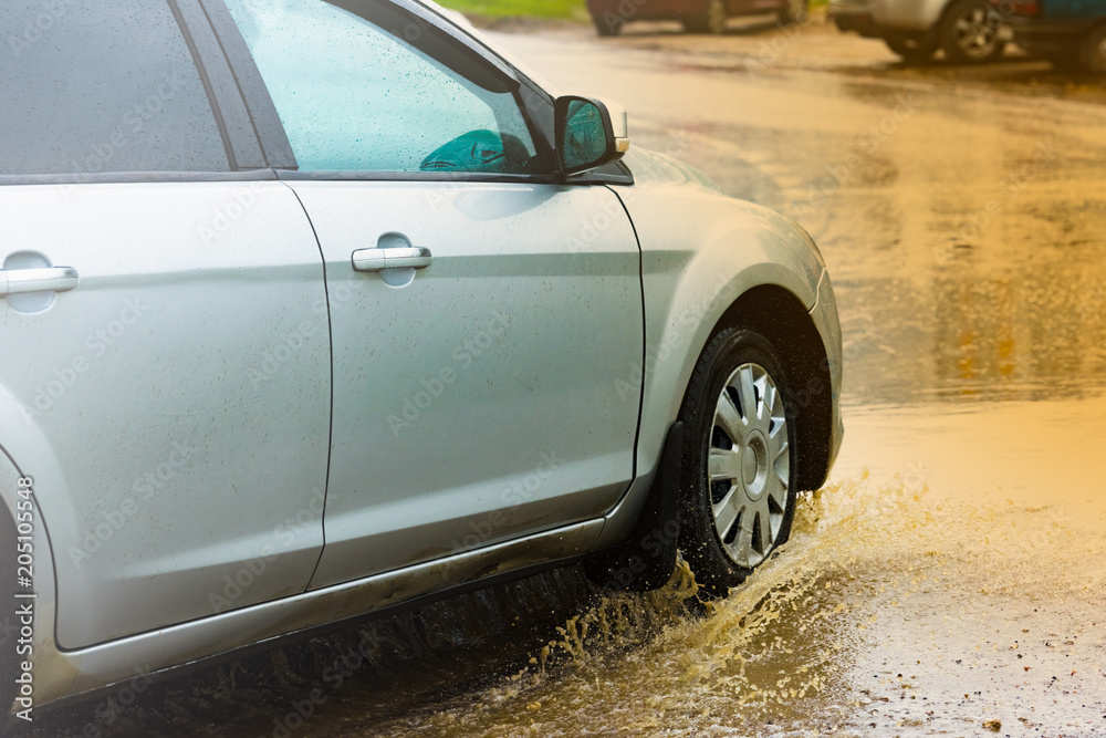 car rain puddle splashing water