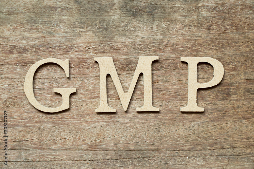 English alphabet in word GMP (Abbreviation of good manufacturing practice) on wood background English alphabet in word GMP (Abbreviation of good manufacturing practice) on wood background
