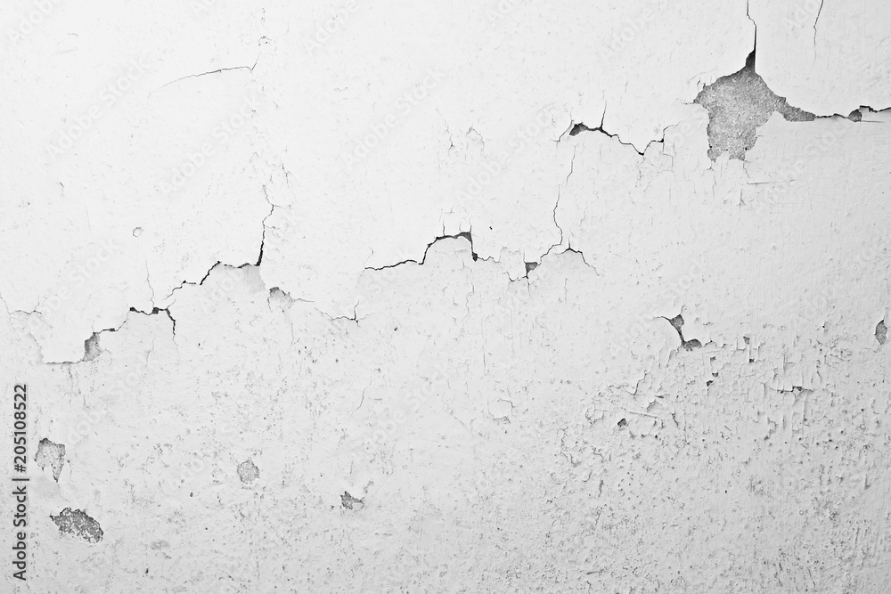 Naklejka premium cracked concrete wall covered white cement background