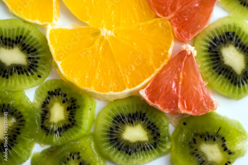 sliced KIWI fruit with a slice of grapefruit and oranges healthy eating