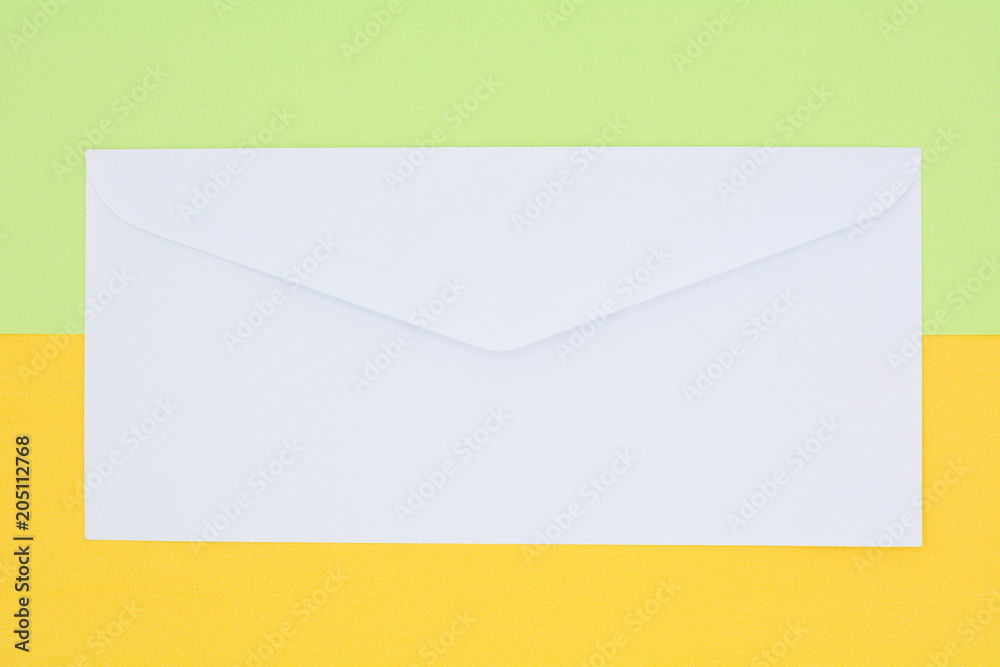 white envelope mail on yellow and green background white envelope mail on yellow and green background