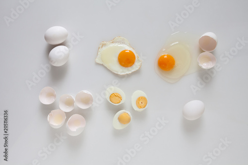 Set of fried boiled raw eggs on a white.