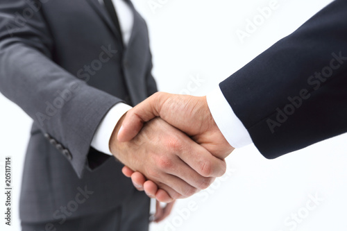 Businessman by handshake invites to cooperation.