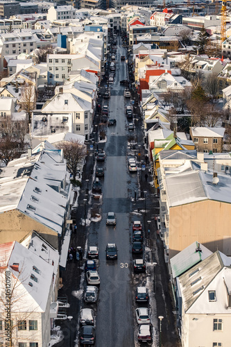 Aerial view of traditional urban developement in Reykjavik, Iceland in winter with snow covered roofs viewed from above.