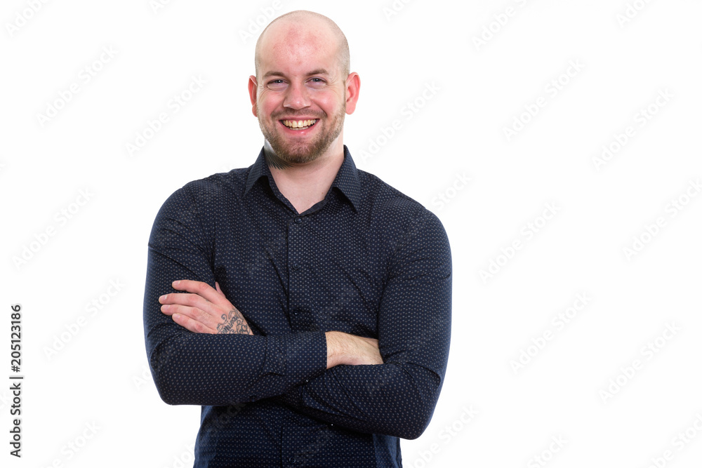 Studio shot of young bald muscular businessman Studio shot of young bald muscular businessman